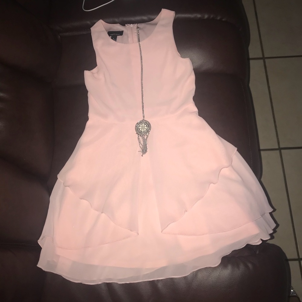 Baby pink dress with beautiful accessorie.
